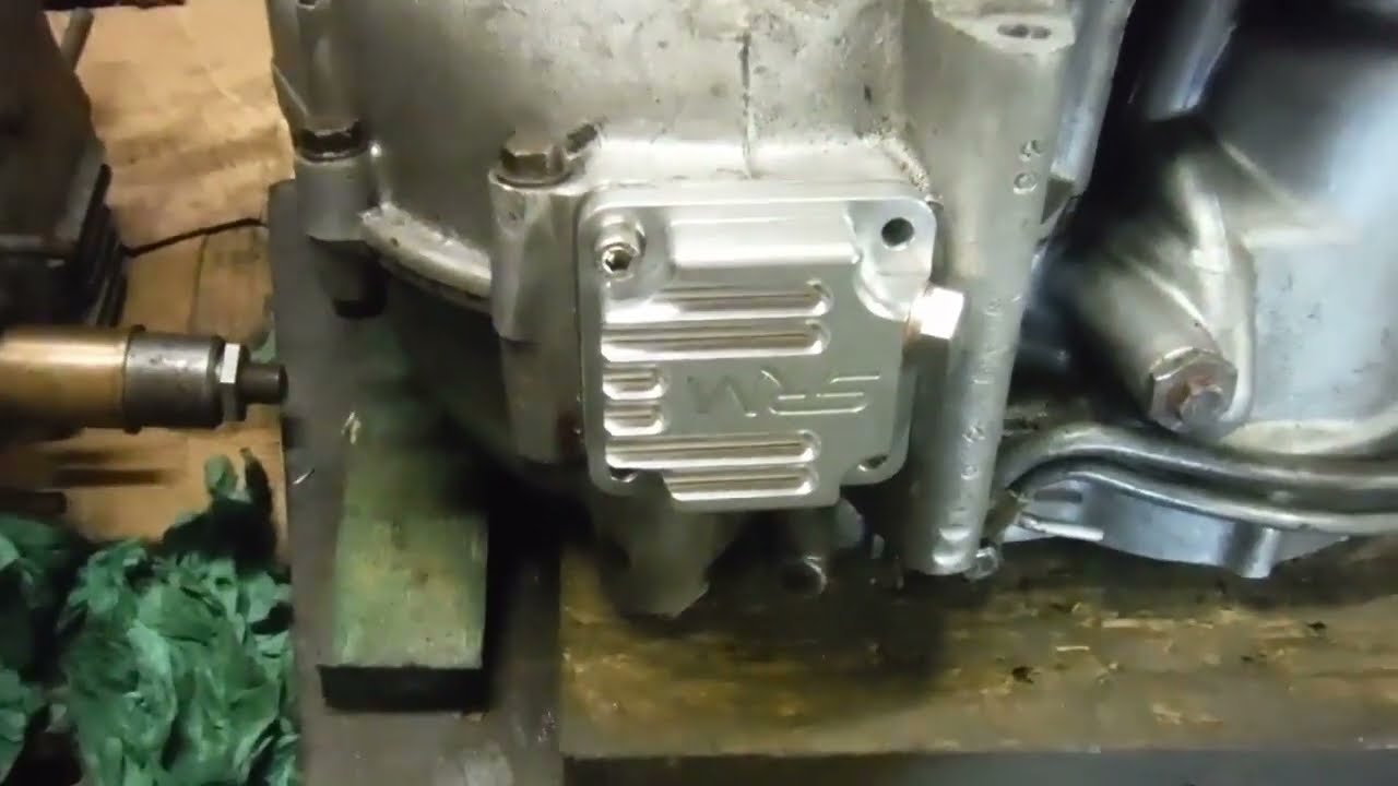 BSA A65 bodged sump plate thread the repair job discussed.