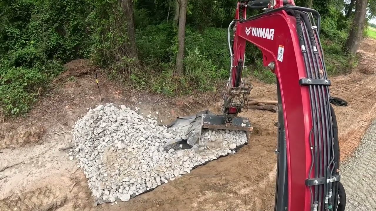 Installing Rock Around The Culvert Pipes