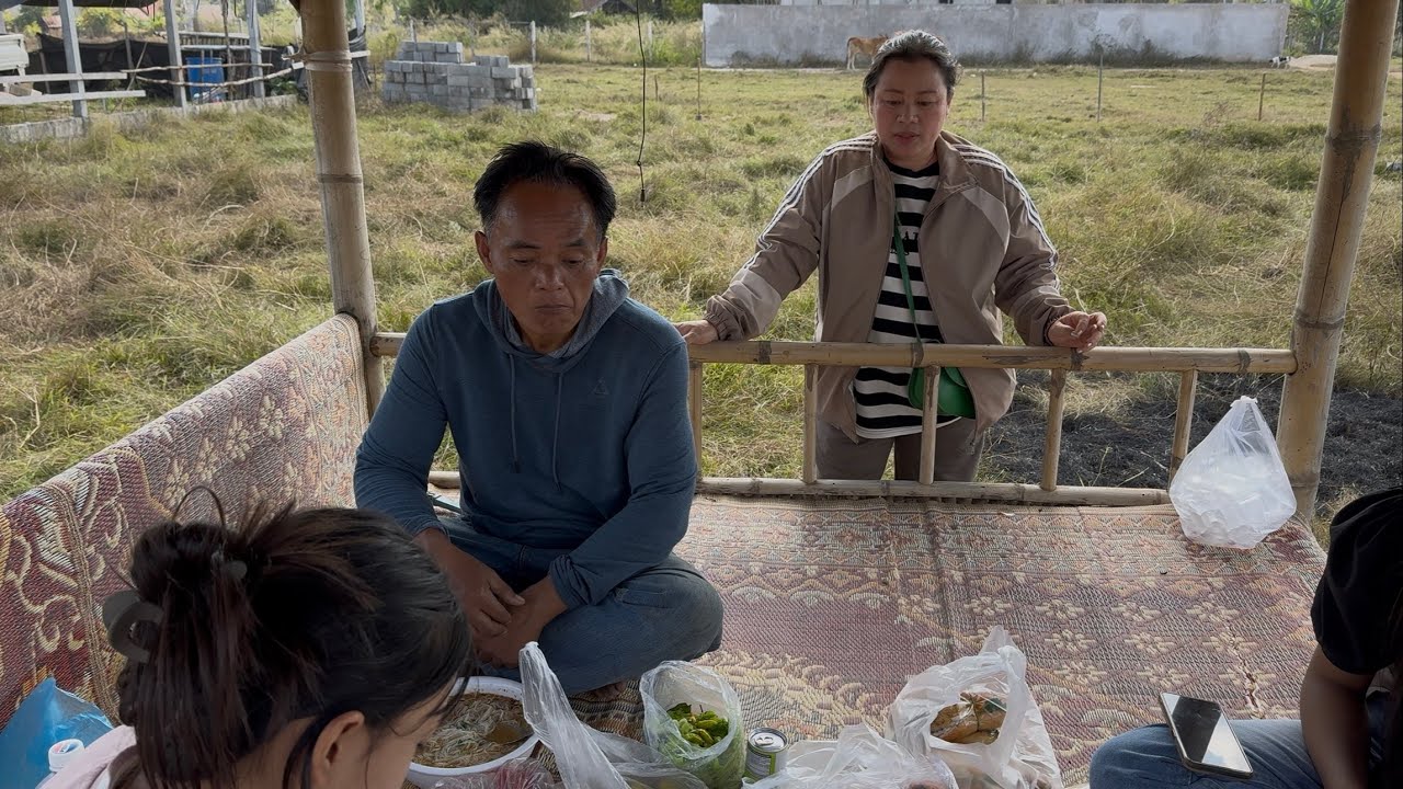 Brother OT came from USA to married his wife in Laos.He bought land, and now he is building a fence.