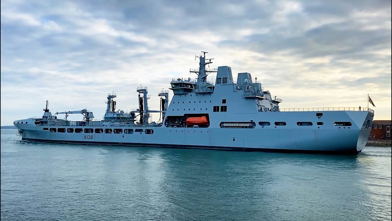RFA Tidesurge dusk departure from Portsmouth