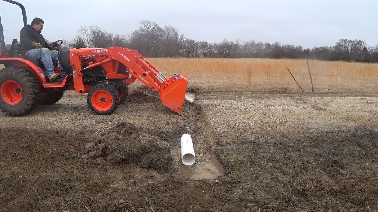 Ep. 33 - Installing a Culvert Pipe Under the Driveway with the Kubota B2650 and Rhino Box Blade