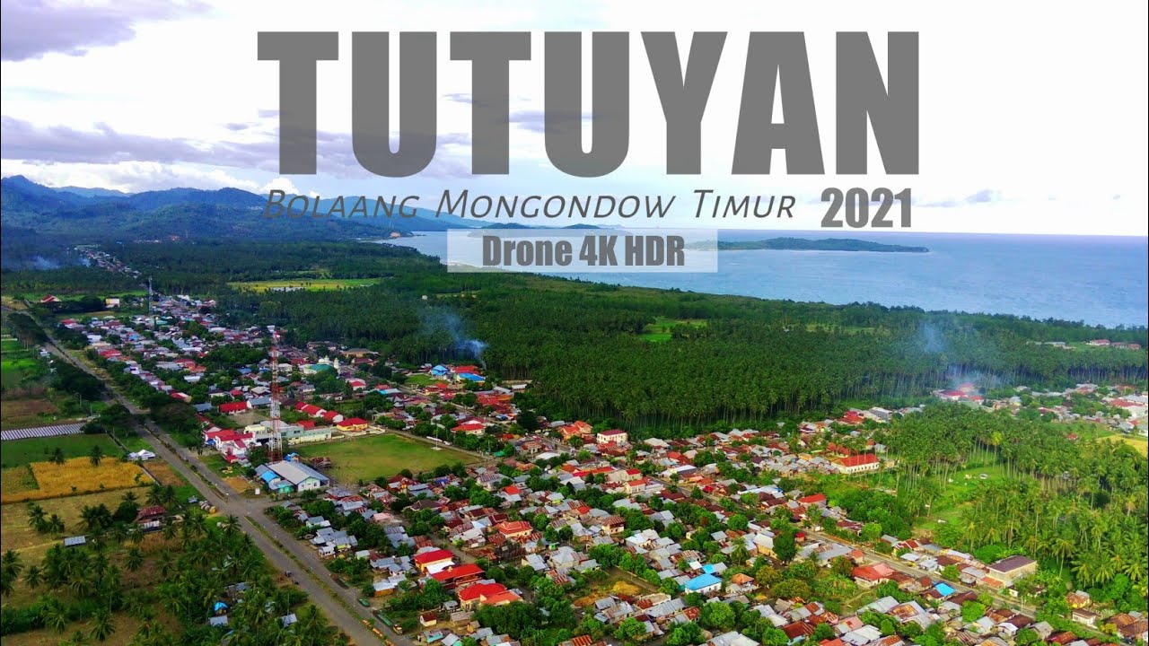 Tutuyan Ibukota Bolaang Mongondow Timur (Boltim) di Tepi Laut Maluku yang Indah | Drone 4K HDR View