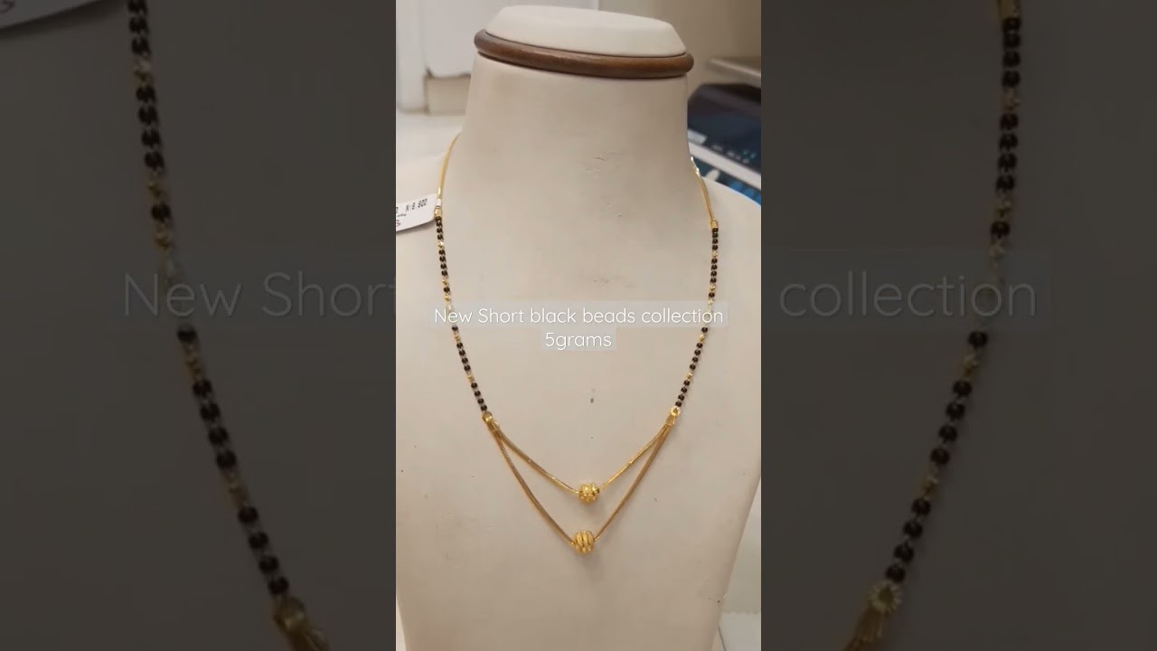 Gold Light weight short black beads 5 grams
