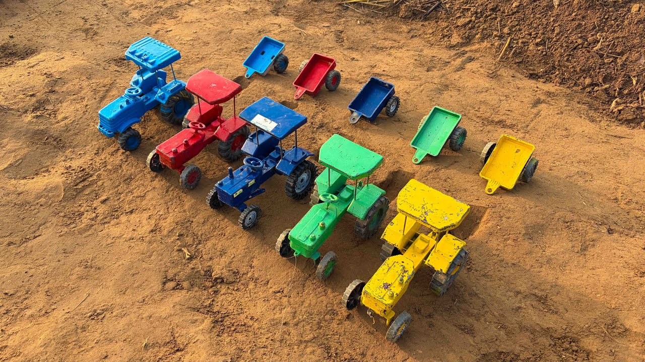 All the tractors are lined up, ready to carry their trailers.  They are loaded with heavy soil.