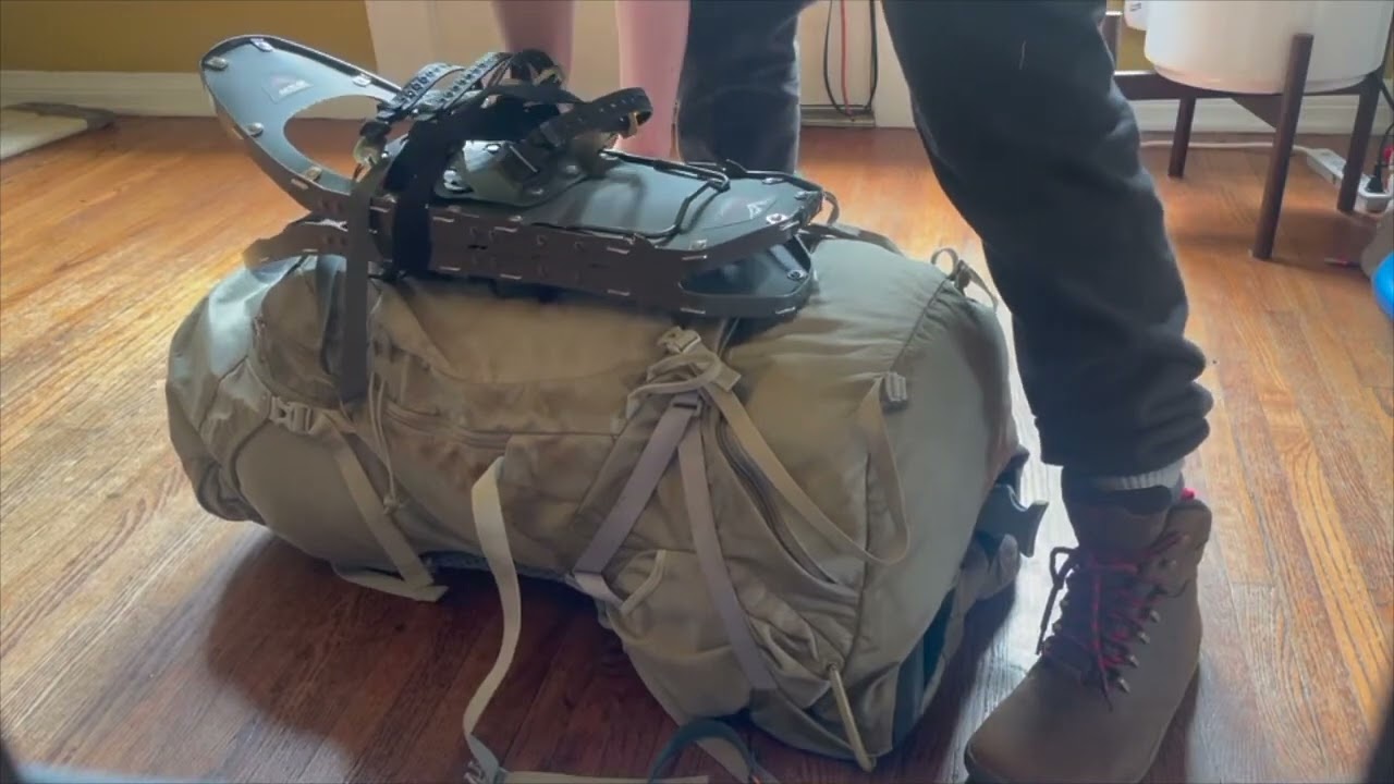 Attaching Snowshoes to Osprey Backpack by Tiffany