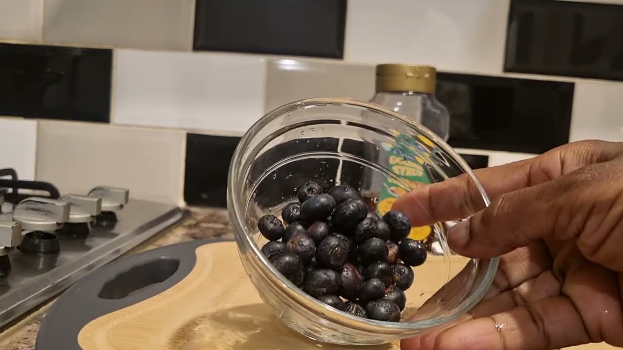 Simple  delicious  blueberries  yoghurt delight with fruits and nut 