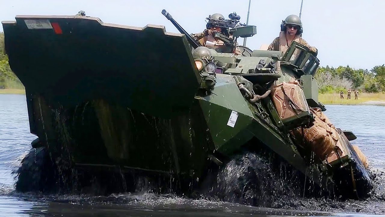US Marines on LAV-25 Armored Vehicles Overcome a Water Barrier and Live Fire From an ATGM
