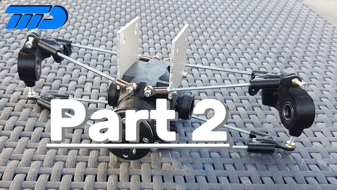Assembling two RC-car rear differentials and suspension parts.