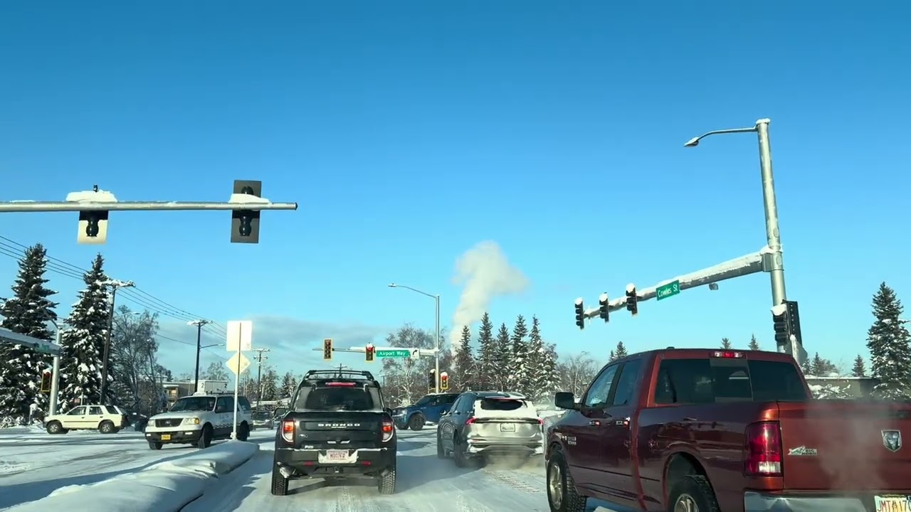 A long, snow-covered road during the winter months in Fairbanks, Alaska.