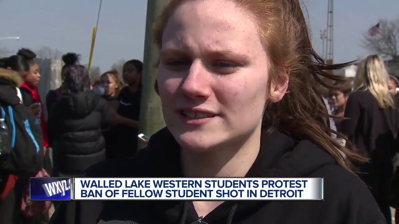 Students hold walkout protest after Walled Lake school banned teen who was shot