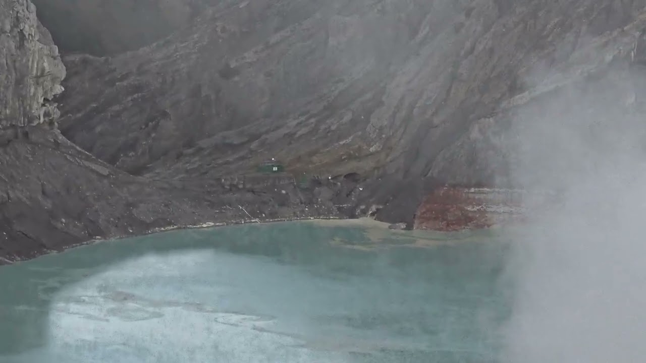 Kawah ljen,  active volcano Indonesia. Turquoise-colored, world's largest acidic lake  