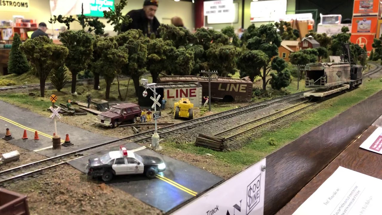 HO Scale Ethanol Train rolls by derailment scene