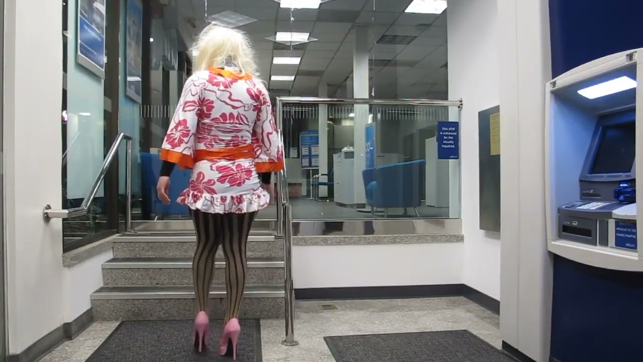female mask crossdresser having fun in the bank
