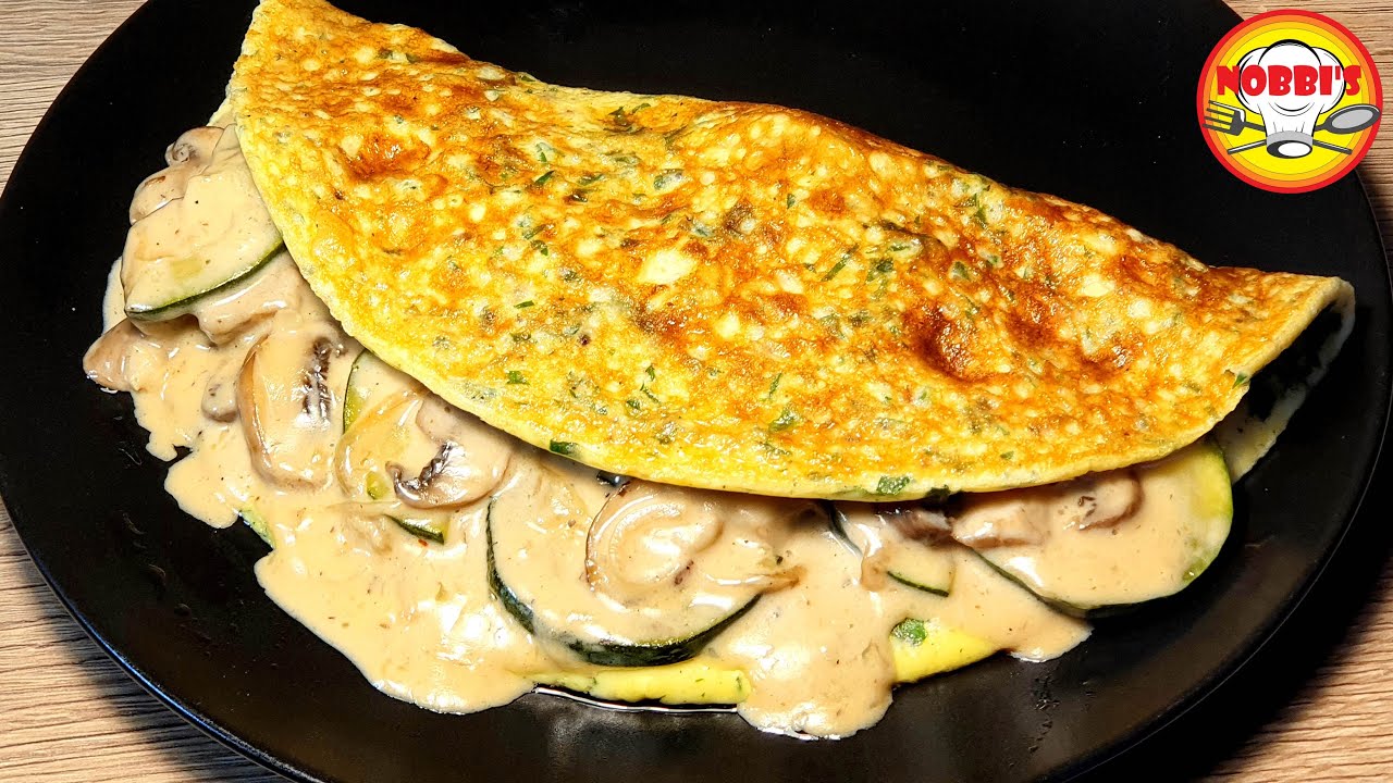 Омлет с начинкой из обжаренных на сливочном масле чесночных грибов