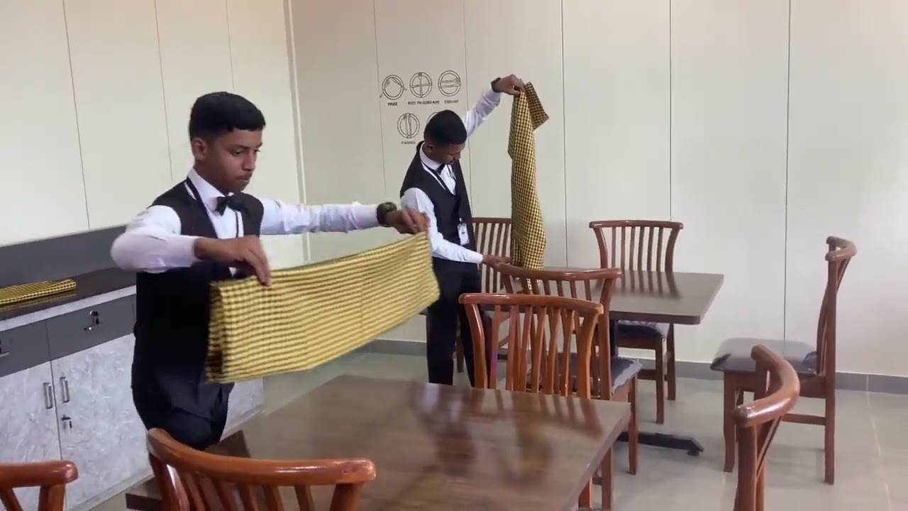 Laying of Table cloth .
