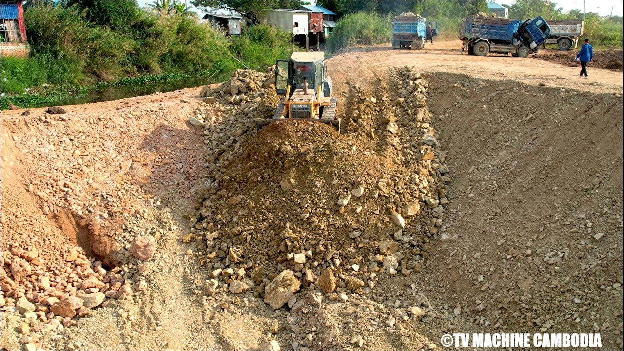 Perfectly Showing Project Canal Slope Foundation By Dozer Pushing & Truck Dumping Stone On Downhill