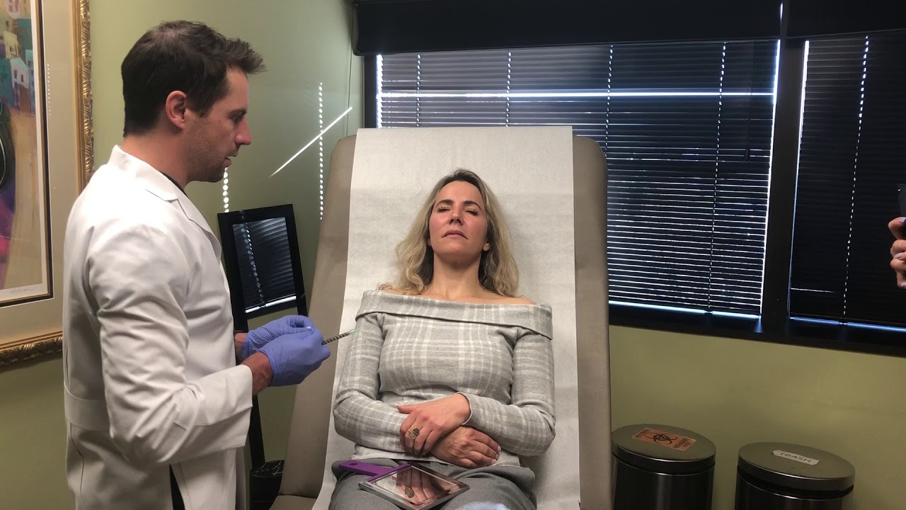 Dr.  Ladner Performing a Botox Procedure on a Returning Patient at Ladner Facial Plastic Surgery