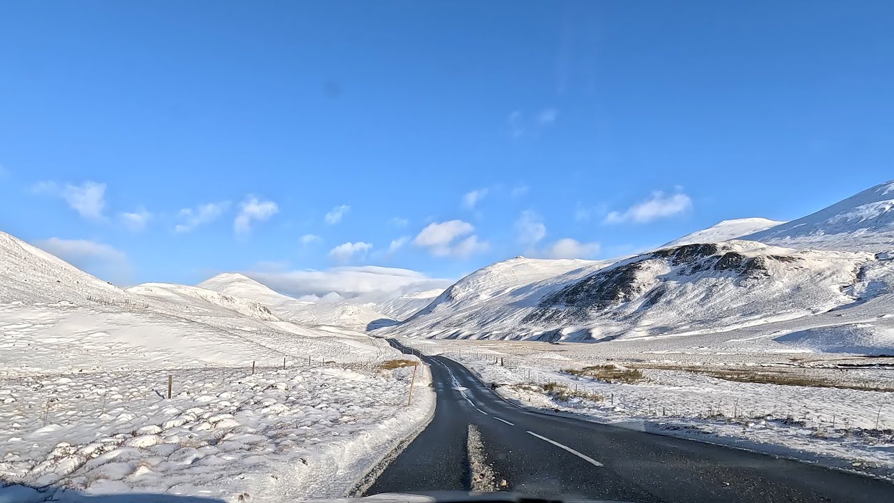 The A93 Snow Road through Cairngorms National Park past Glenshee Ski centre in Scotland January 2024