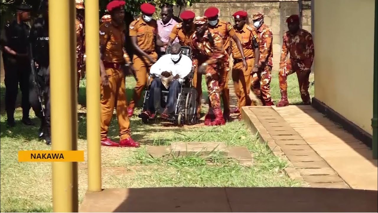Dr. Besigye and Obedi Lutaale in Court - Accused charged with treason and misprision of treason