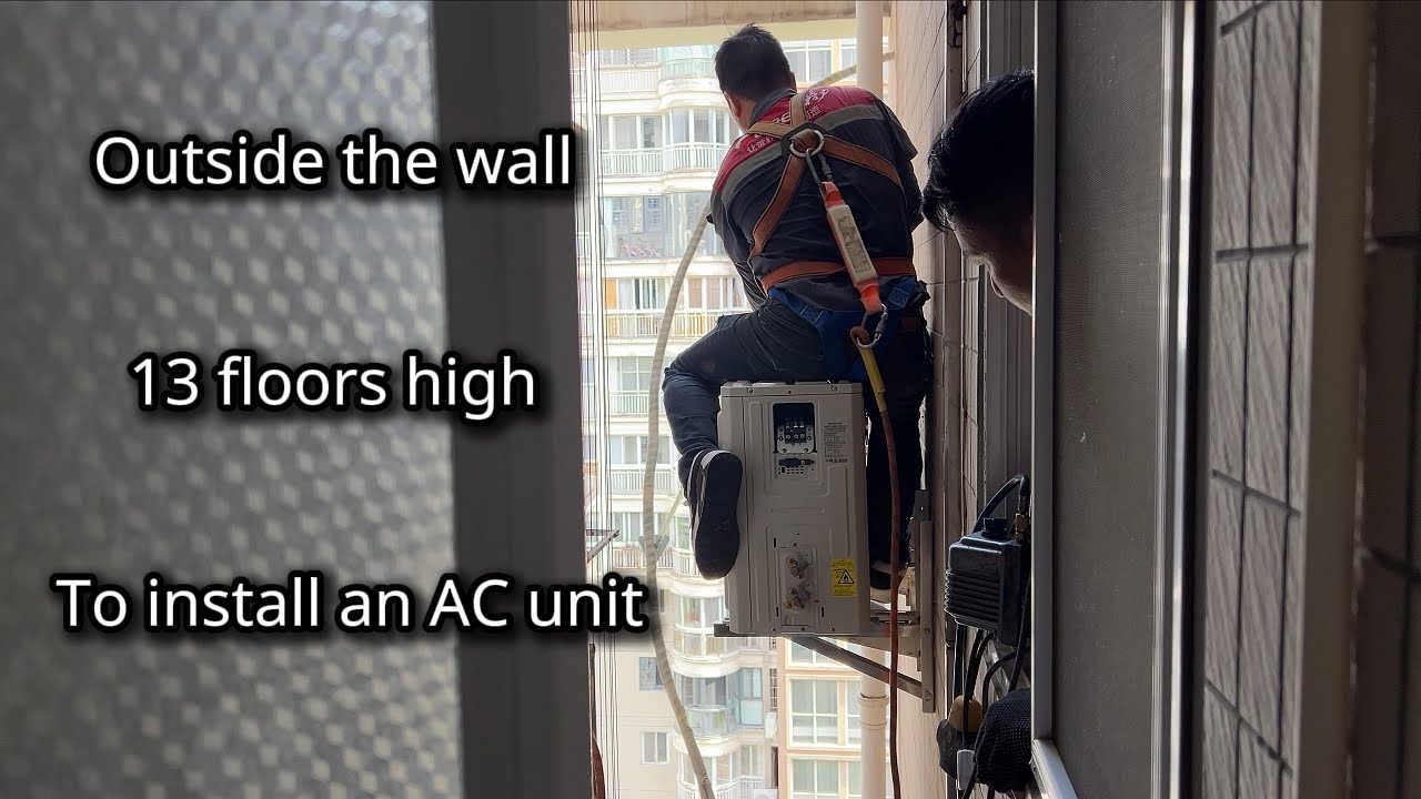 He’s Hanging Outside the 13th Floor to Install My AC