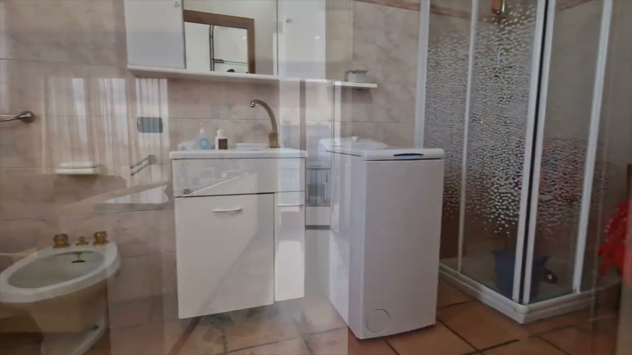 PORZIONE DI BIFAMILIARE CON TAVERNA, GIARDINO, TERRAZZO E BOX