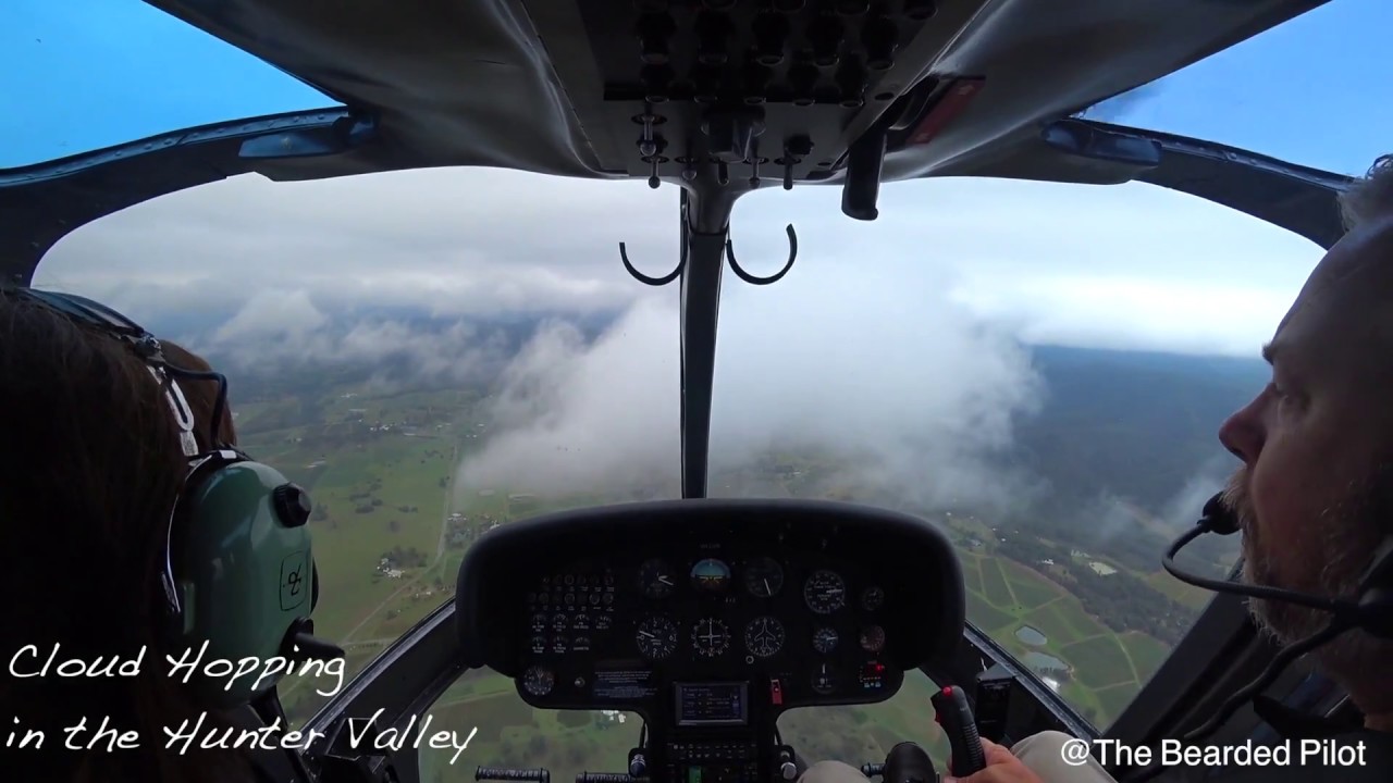 B206 Jetranger Hunter Valley Helicopter Flight over mountains and clouds