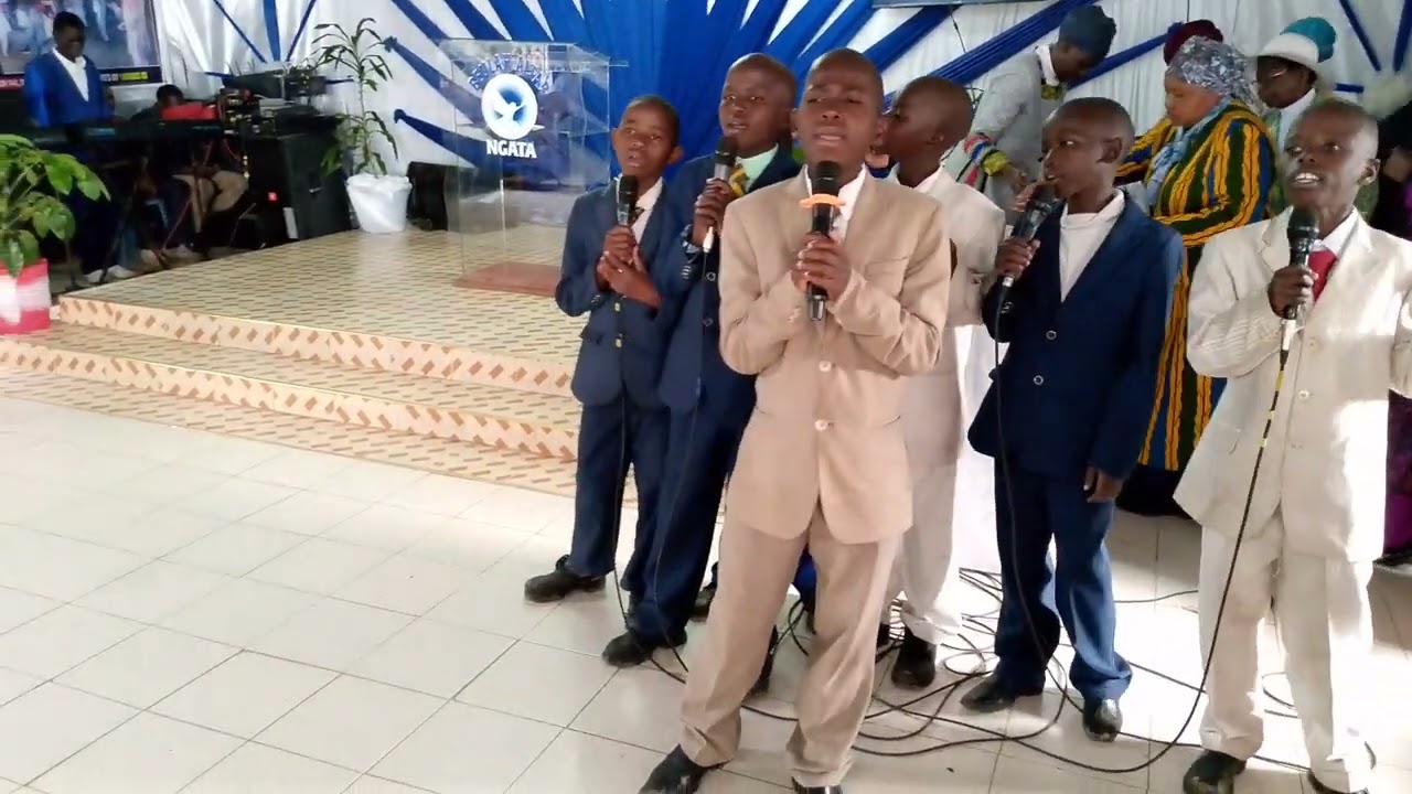 THE ICM TEAM SINGING BEFORE THE CHURCH