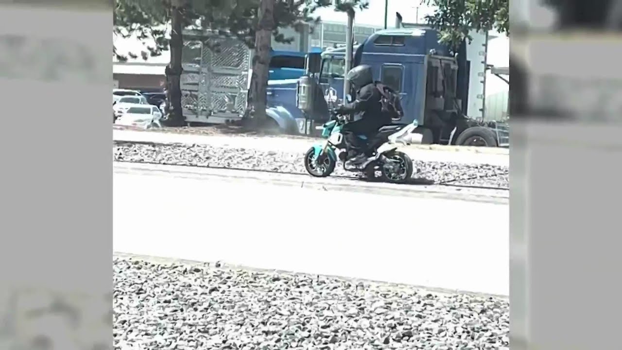 Motorcyclist smashes rock through woman's window