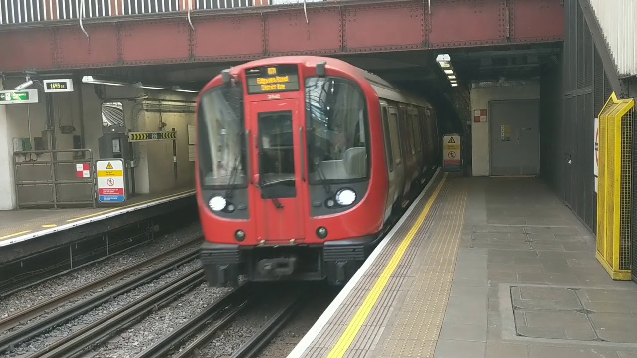 HD Fulham Broadway Station, District Line trains from westbound platform. London underground tube.