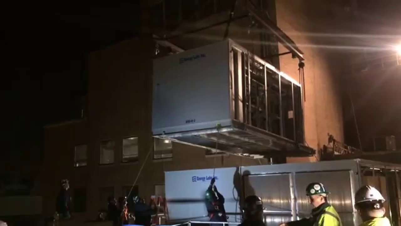 Rigging 25,000 pound HVAC section to the roof.