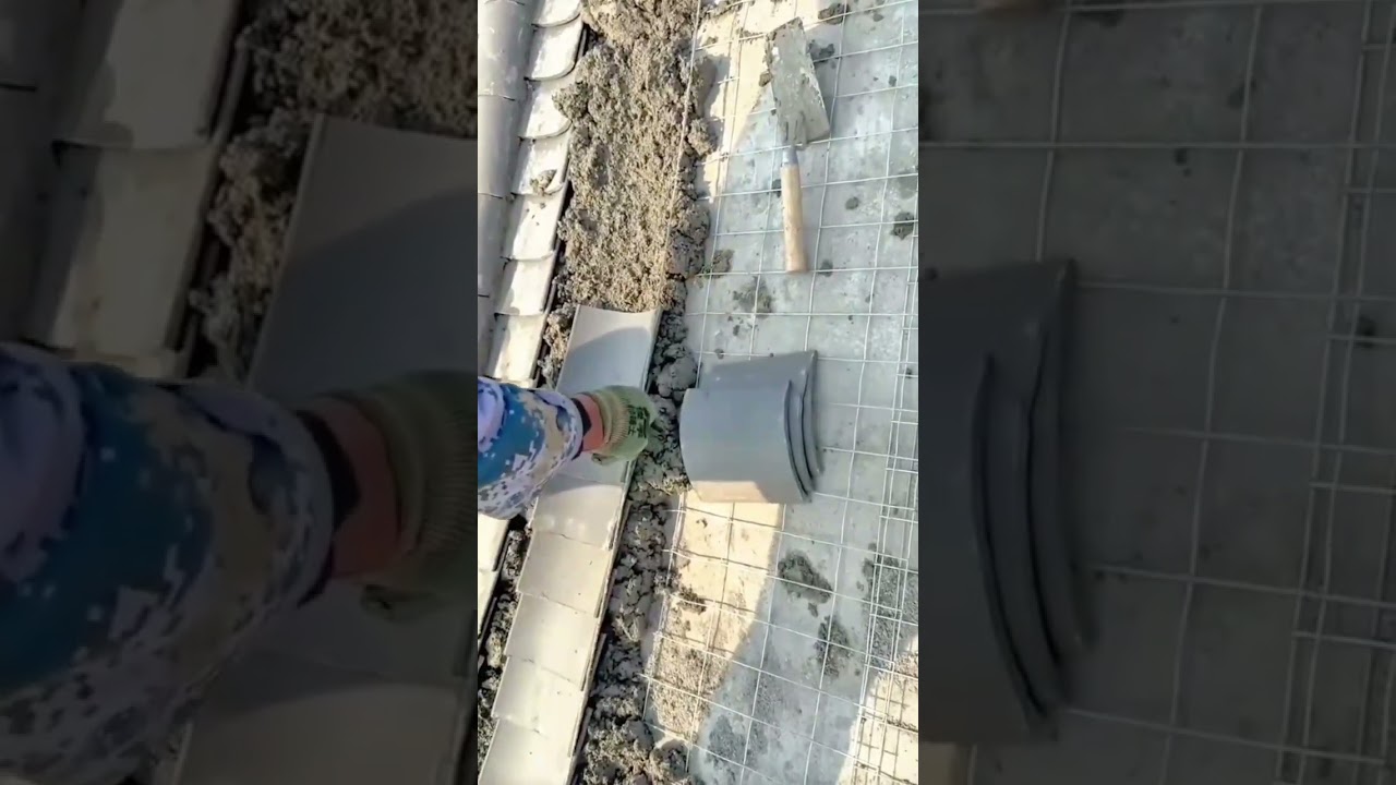 installing traditional clay roof tiles on a metal wire mesh structure 