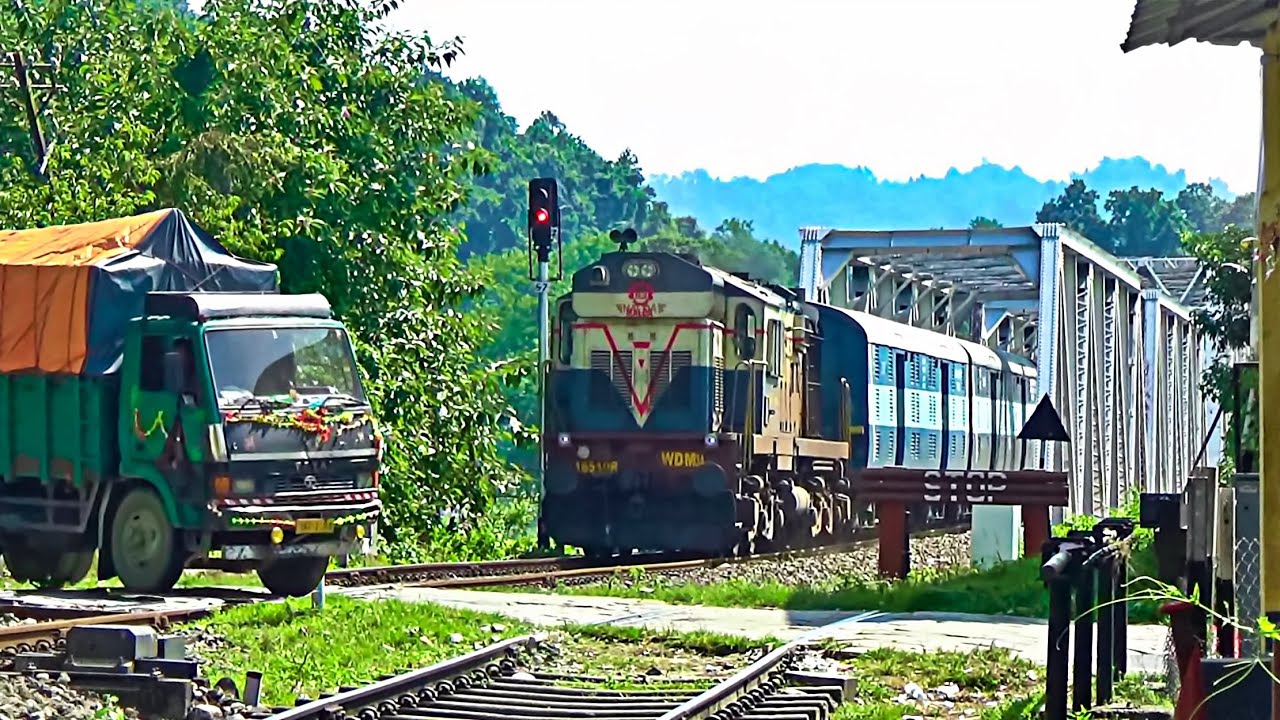 Speedy Siliguri Intercity Express crossing TEESTA railway bridge & busy rail gate at Sivok