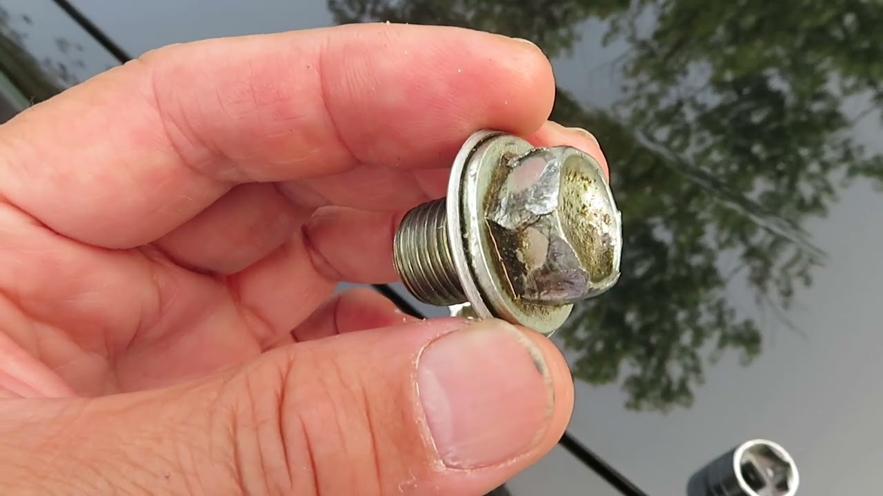 Proper oil change technique, tools and new washer to prevent striping rounded drain plug bolt head