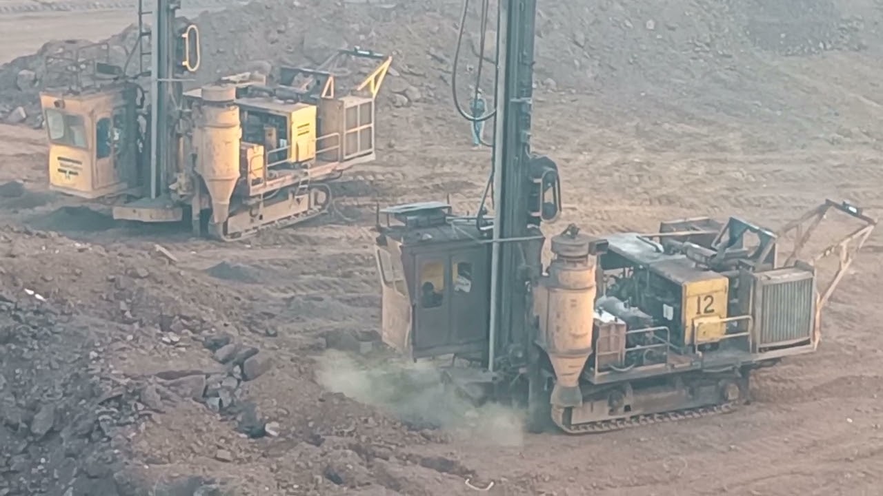 Operation of the drilling machine in iron ore mines. How mining is occurring in open cast mines