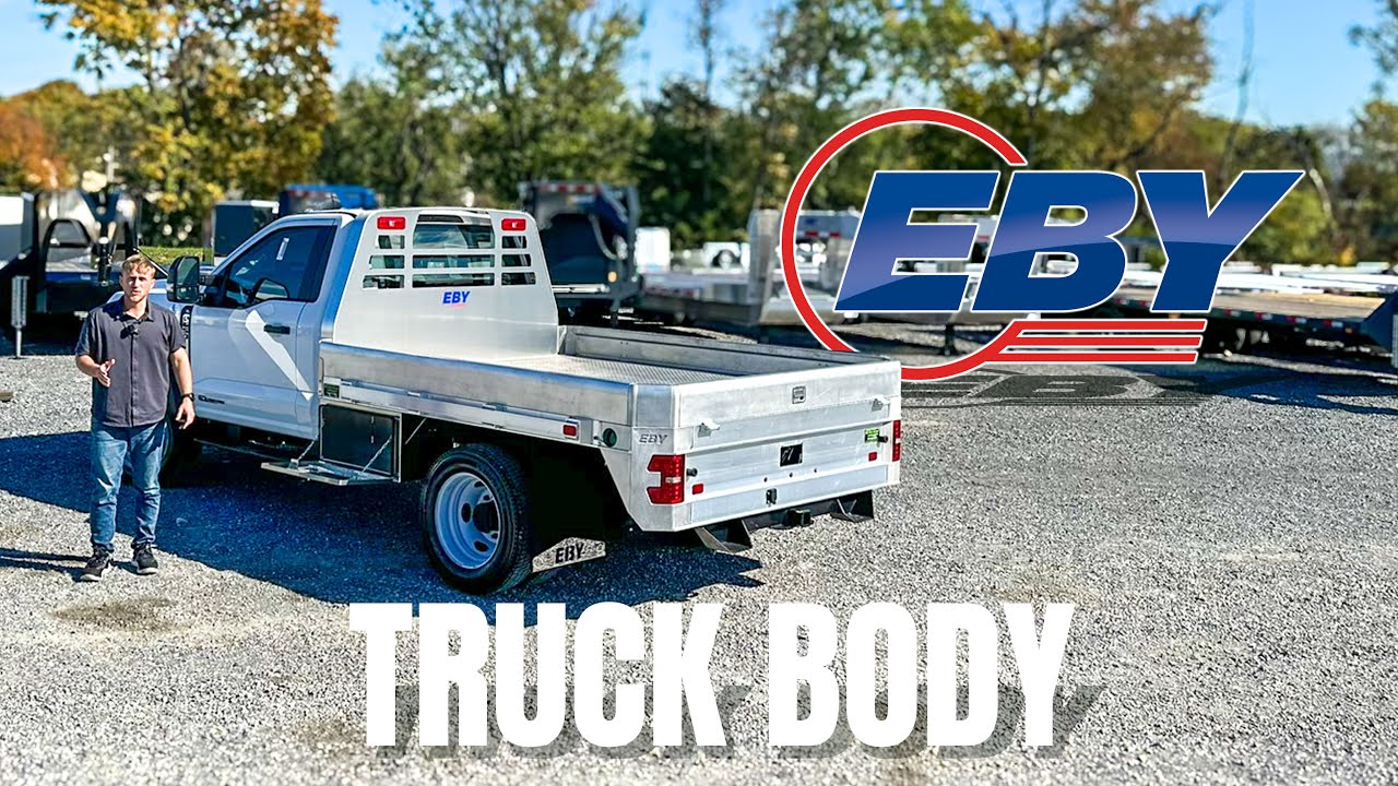 This is the EBY Big Country Truck Body Flatbed With Sides and A Gooseneck Hitch