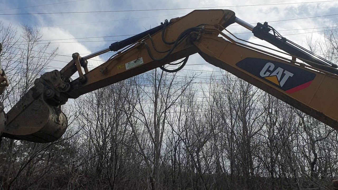 Driving sheet pile with excavator