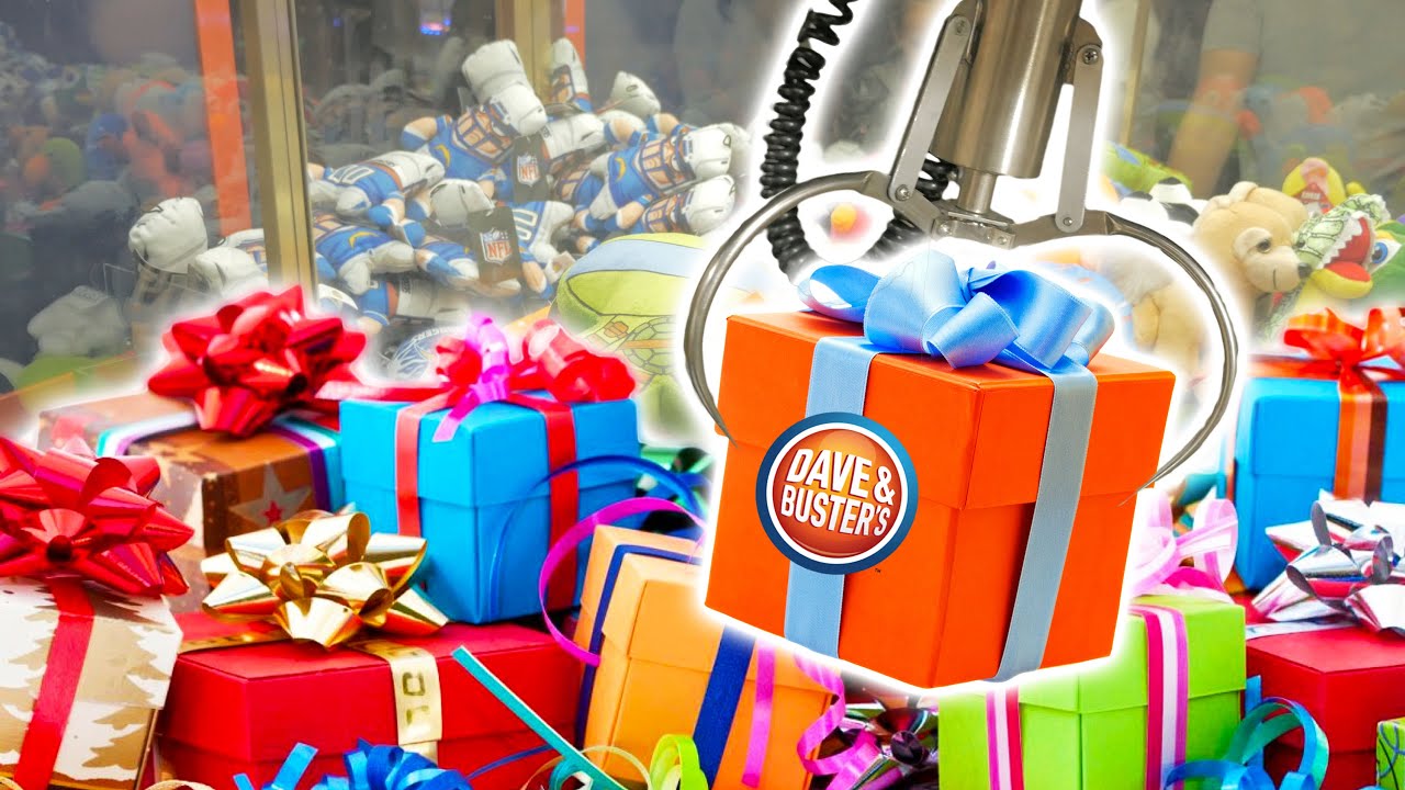 Cleaning out the claw machine for birthday presents at Dave and Buster's!