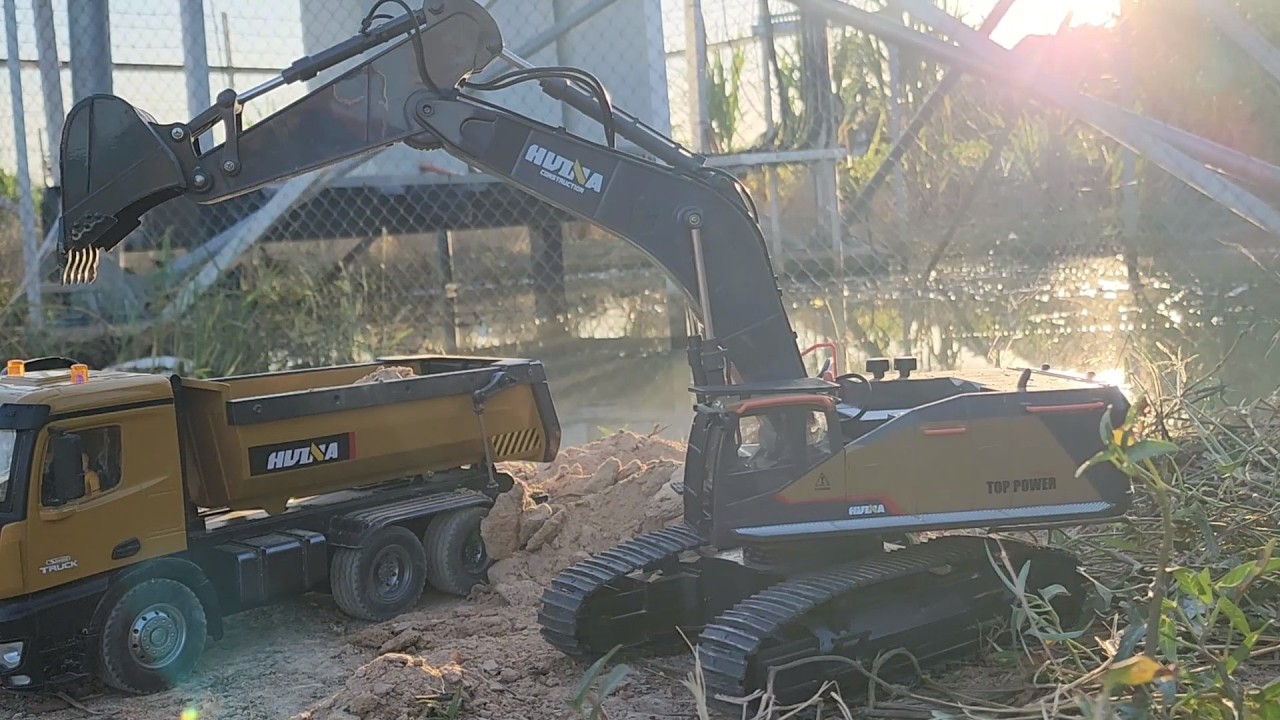Miniature Earthmovers: RC Excavator and Dump Truck at Work