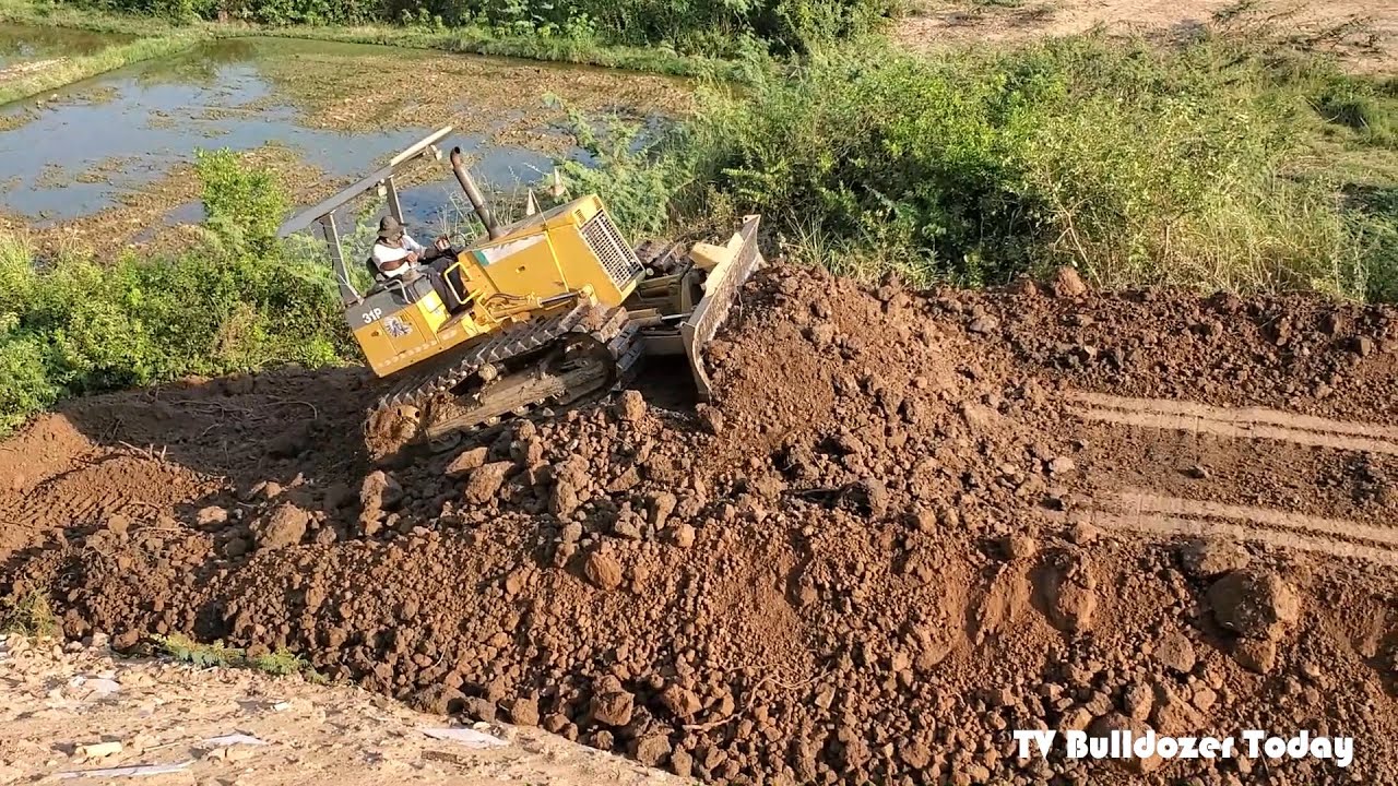Step6- Good work activities KOMATSU D30P Pushes the Ground to Fill a Deep Pit​ & Dump Truck