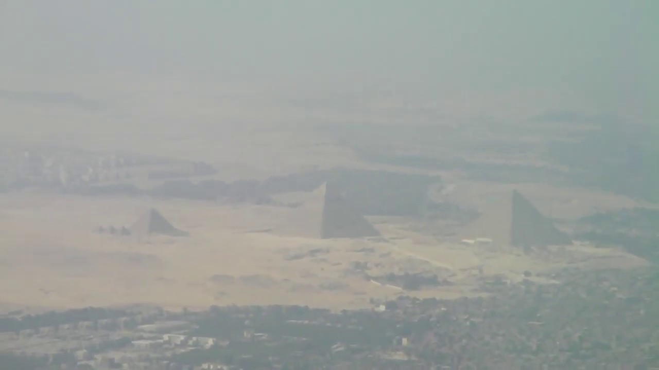 Landing in Cairo Airport with a fascinating view of the Giza Pyramids from the plane