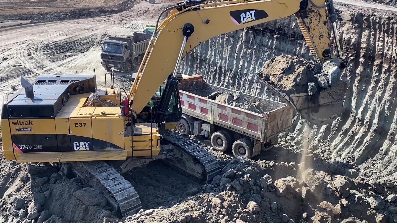 Cat 374D Hydraulic Excavator Loading Trucks With Three Passes - Interkat SA