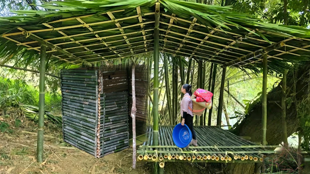 The girl decided to build a small house out of bamboo in the forest.