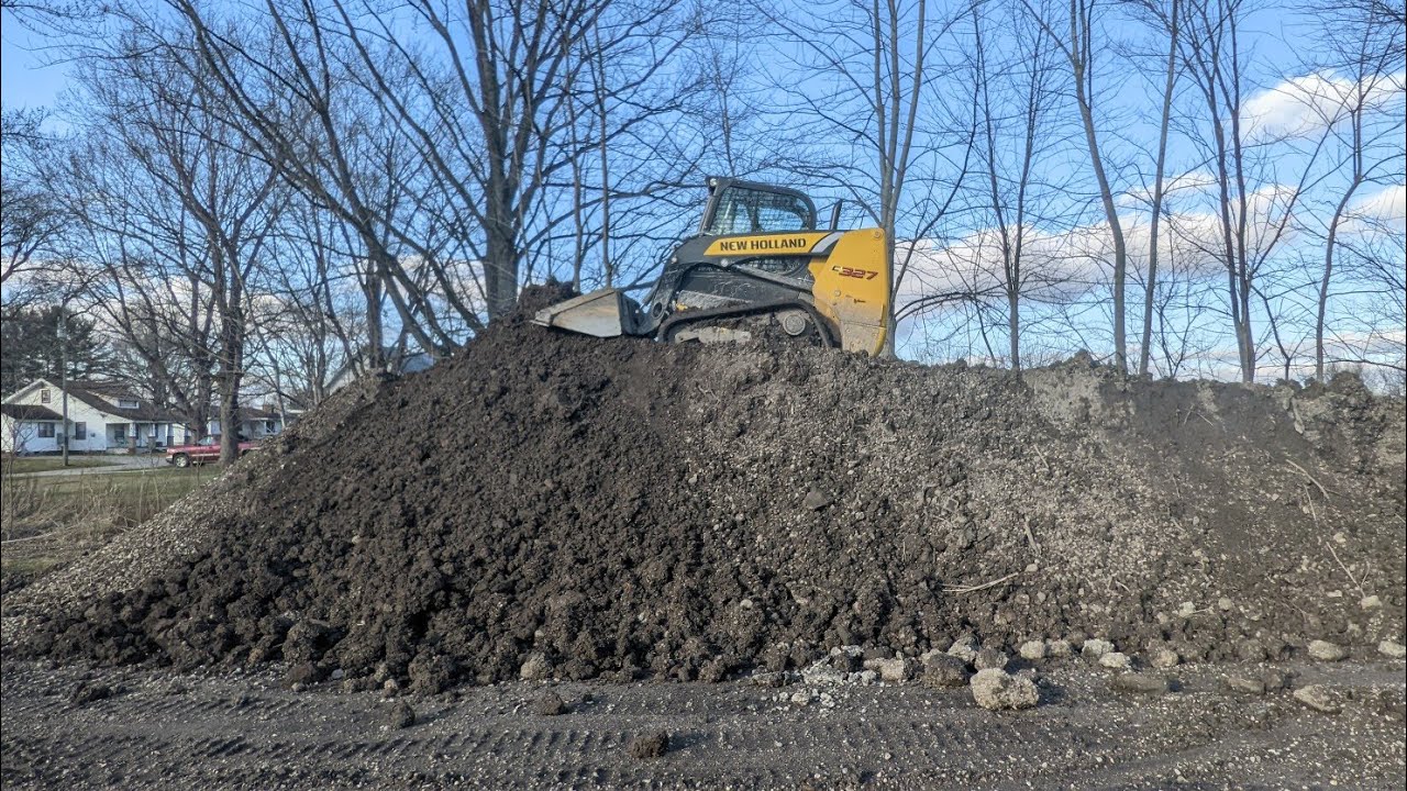 Moving A Dirt Pile With A New Holland 327 Skidsteer Ep. 1