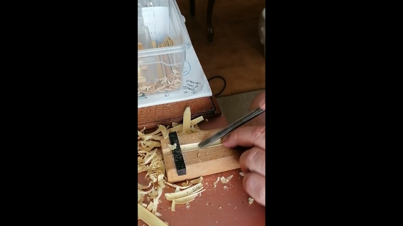 Gouging a baroque oboe reed.