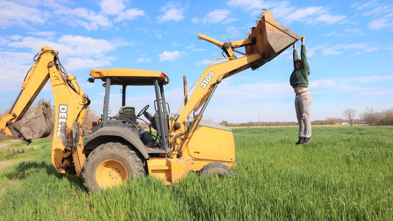 Using our backhoe on the farm | Backhoe digging and loading