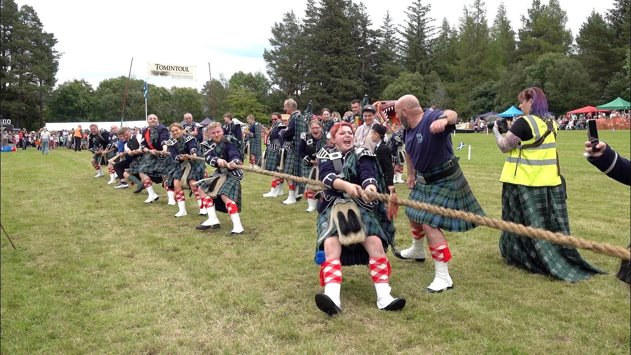 Kilted Pipe Bands Tug of War challenge during the 2024 Tomintoul Highland Games in Moray, Scotland