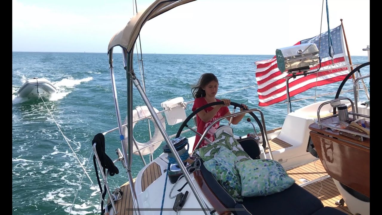 Sailing into the San Diego Bay onboard a Jeanneau 54 Deck Salon sailboat with Marley at the helm