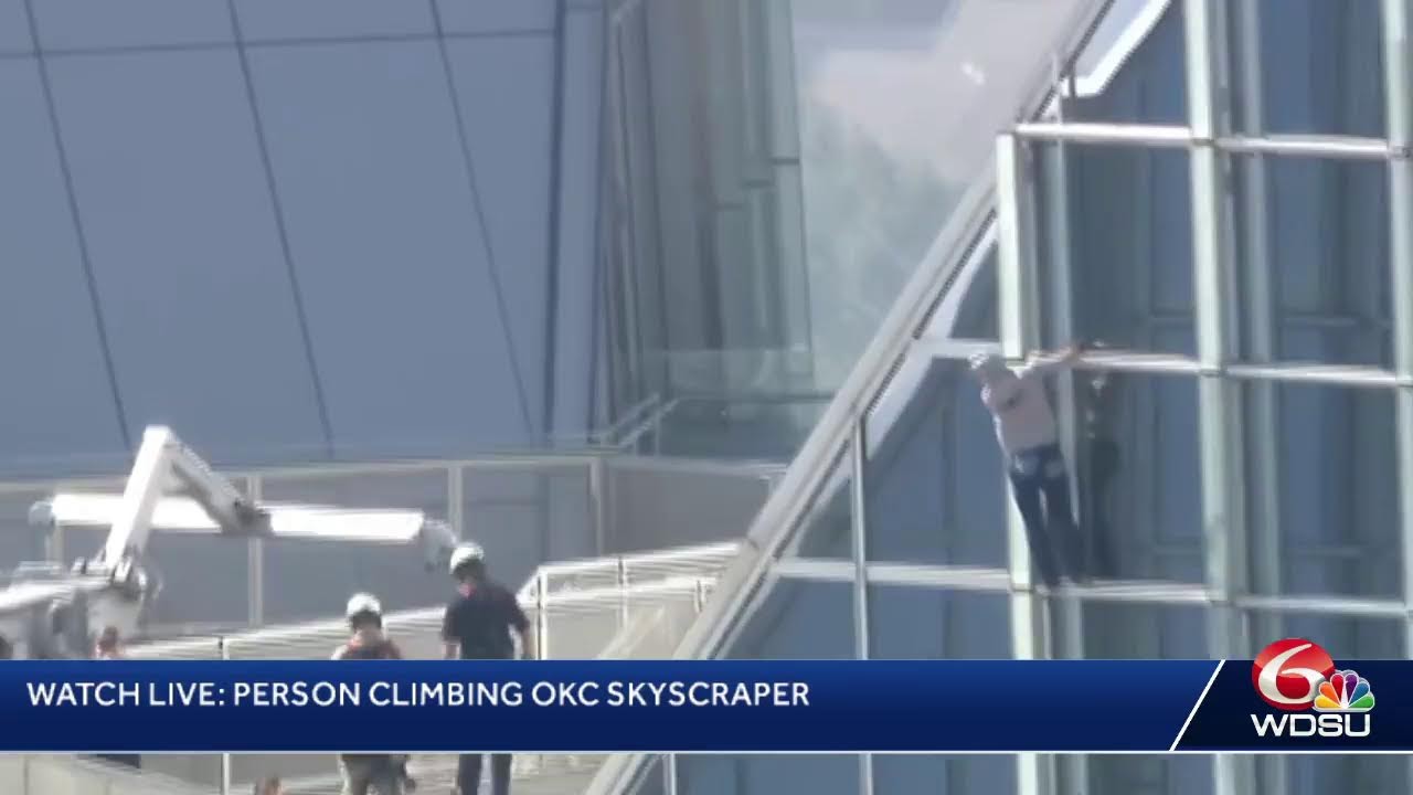 Person climbing OKC skyscraper