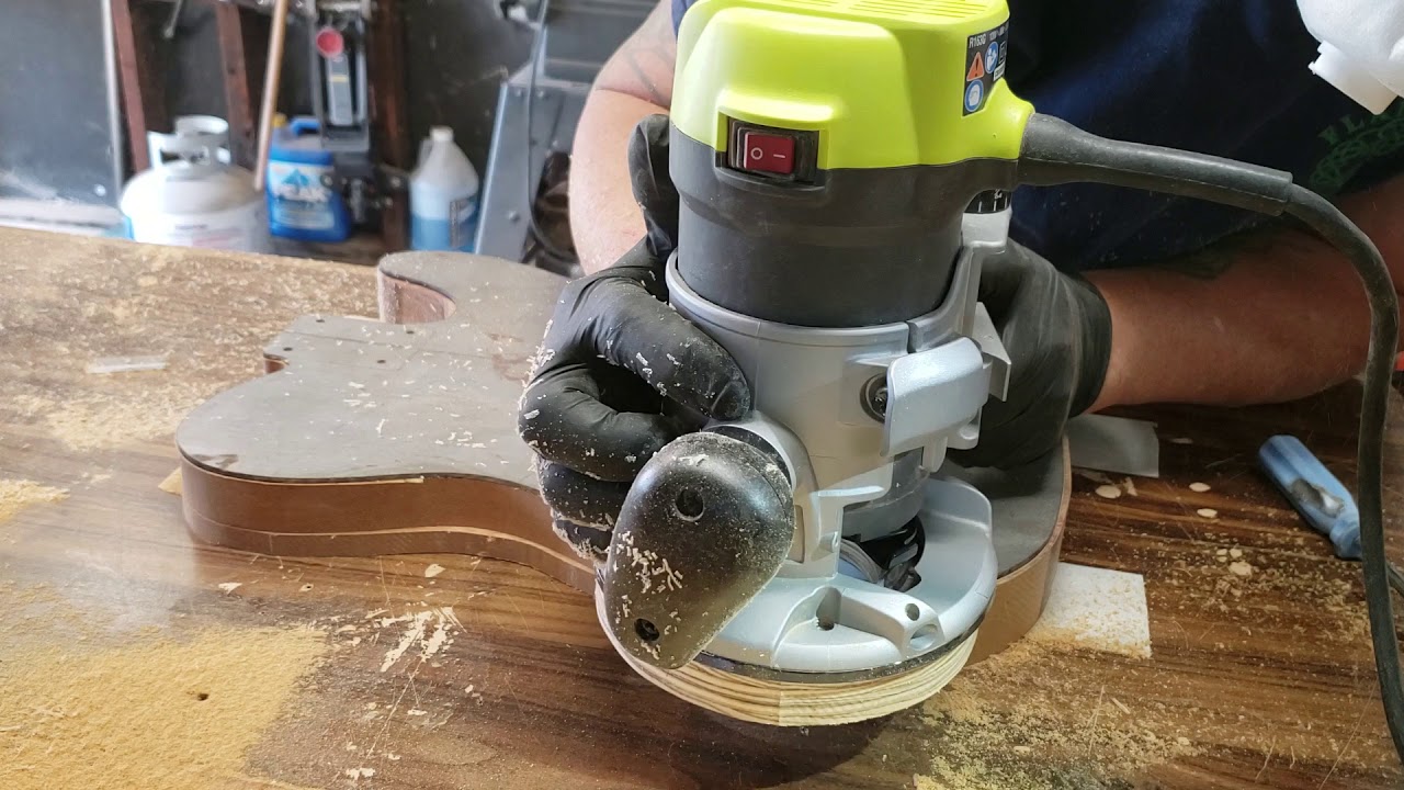 Routing a guitar body.