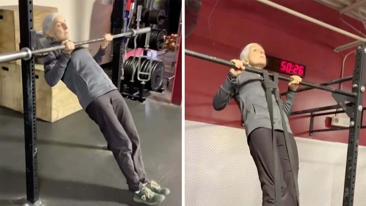 Elderly Woman Learns How To Do Pull Ups At Gym